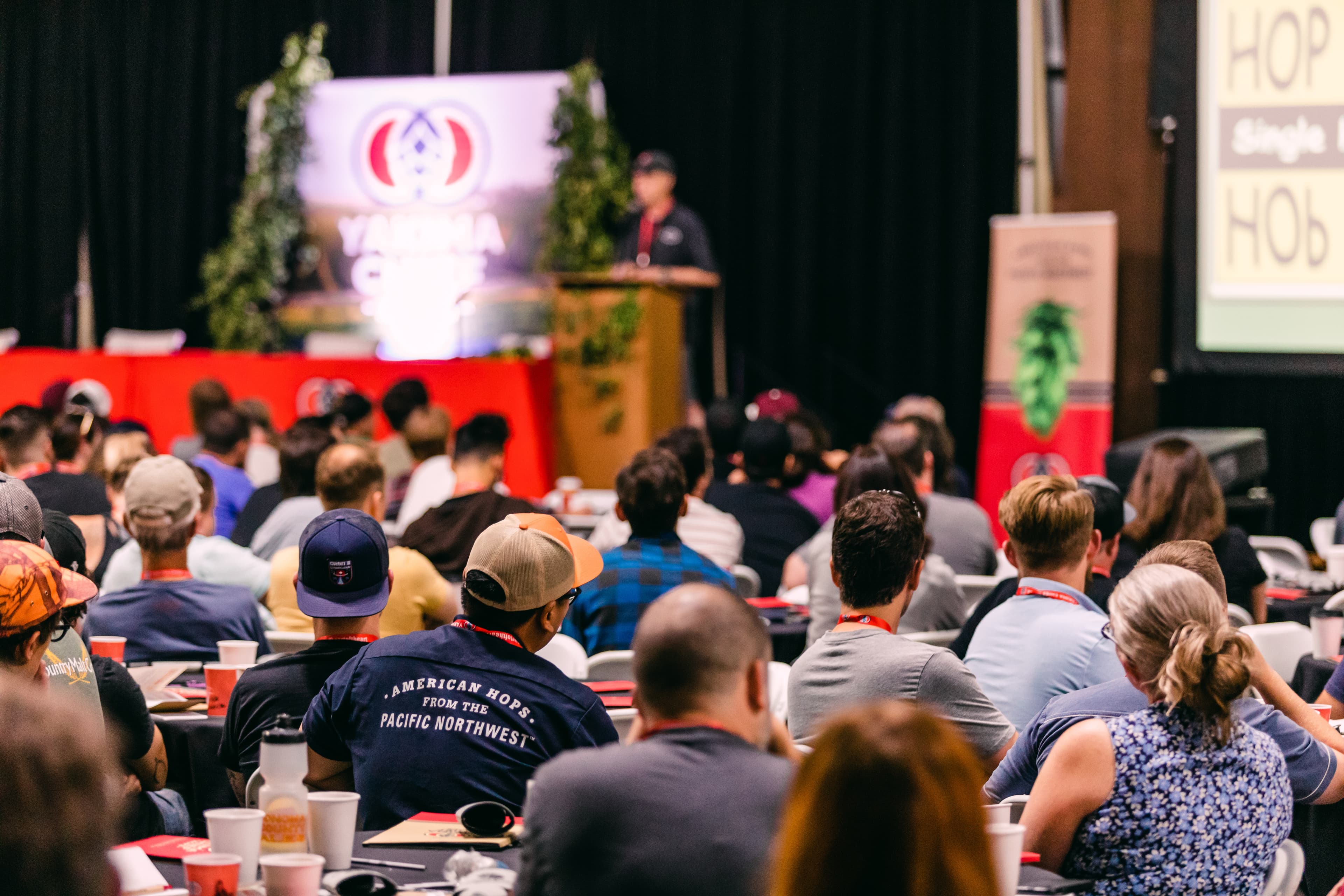 Brewers in large class style setting listening to presenter