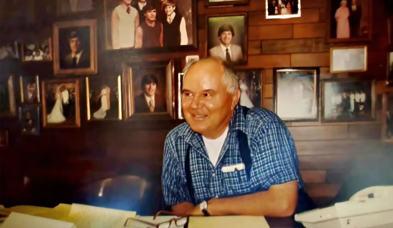 Tom Carpenter Jr. sits at his desk