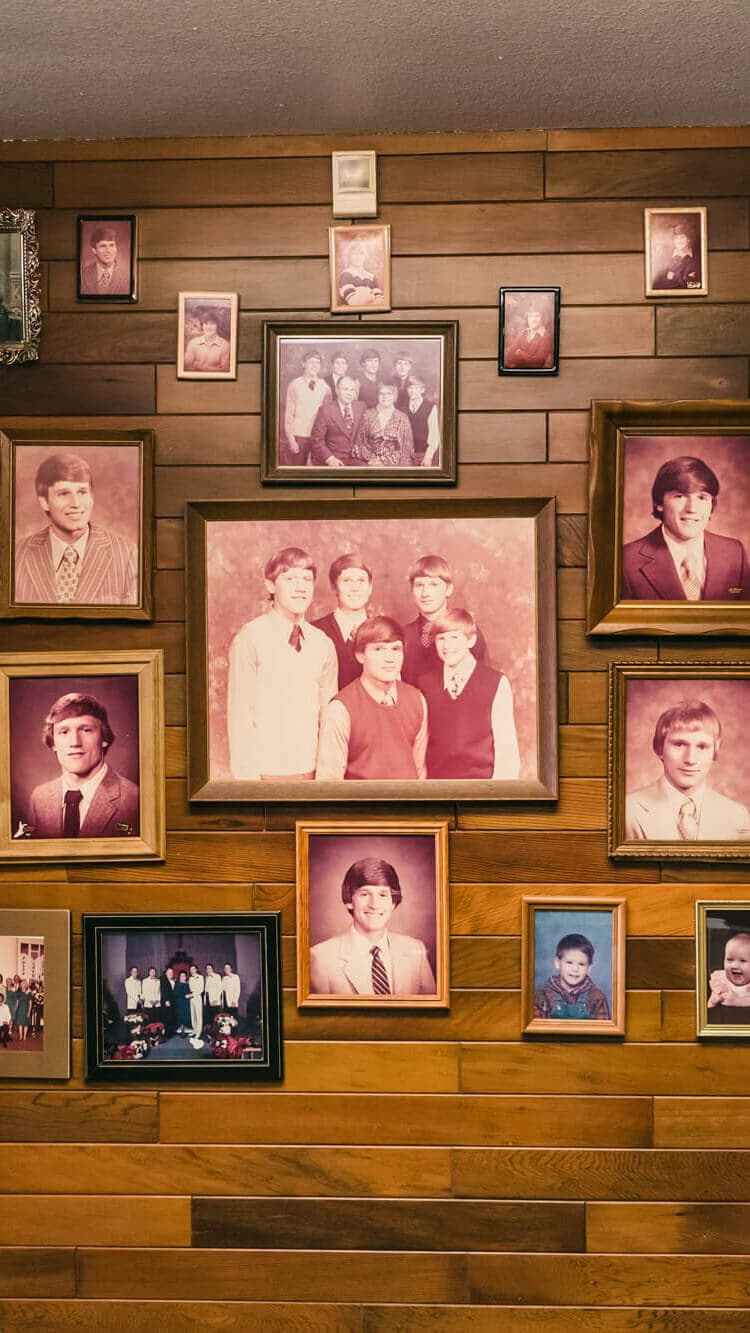 Image of Carpenter family portraits hanging on a wall