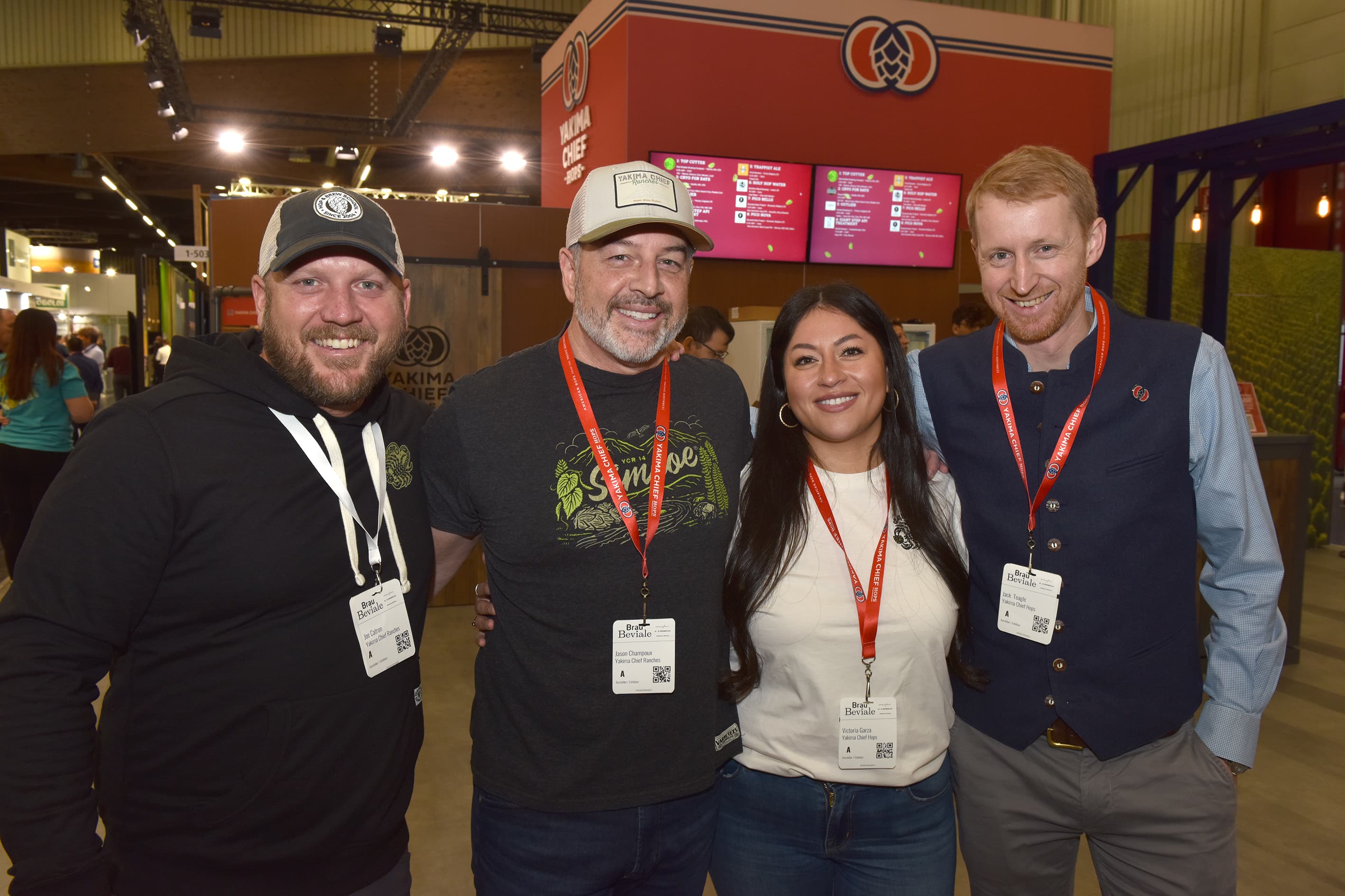YCH team photo in front of the YCH tradeshow booth