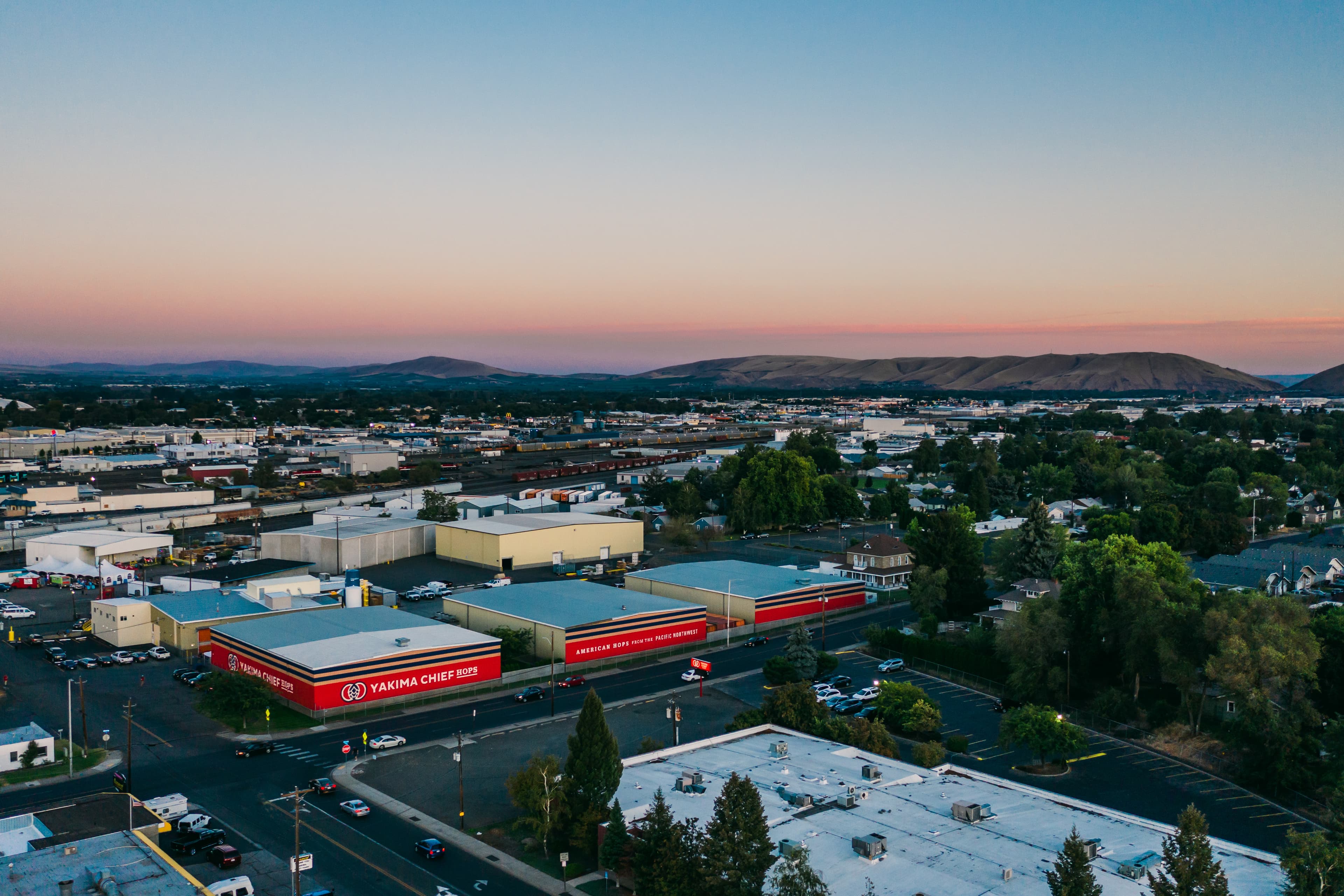 Aerial view of branded Yakima Chief Hops warehouse in Yakima Valley at sunset